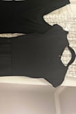 This dress is wonderful! The slit is flirty, but appropriate. It's very flattering. I normally order XS, but the small fit nicely. The only thing that is frustrating is that it is not a true black. It's more of a charcoal, even though some of the posted pictures look black. The photo I added below is a comparison of another true black Lulus dress, and this one is on the right. If it were a true black, I'd give it 5/5! Normally it being true black wouldn't matter so much, but I need it for a wedding party. - Kimberly W.