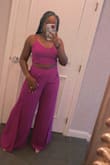I loved this two piece set! The slits on the side stop at your upper thigh when sitting down. The magenta is more on the purple side which I enjoyed. - Taylor S.
