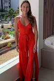 This jumper was amazing and so comfortable. I wore it for a wedding on the beach and got so many compliments on it. I didn't wear a bra with it and it still fit fine (didn't have any issues/nip slips). The material is soft and bright and the tie is easy to tie. The pants are definitely long so if you have time, maybe get them hemmed or wear heels! I ended up wearing flat sandals and the bottoms of the pants ended up getting super dirty (I washed it and the dirt came out). I wasn't tripping over them or anything so it's wearable even if you don't hem them. Buy it!!! I can't wait to wear it again. - Cassidy F.