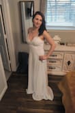 This fit perfectly, I'm a 4 or 5 and the S fit well. There is room for a strapless bra or some push-up but I wore pasties under it. Shoulder straps are adjustable. It was beautiful at my small wedding. I steamed it and wrinkles came out easily. I am 5'5" I wore flats and it was a bit long so be conscious of that if you need to hem it. - Kerry S.
