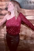 This shirt fits perfectly. The only bad thing is the sequins get stuck together, so many times I found my arm stuck to my torso. And I just had to rip them apart. - Allison B.