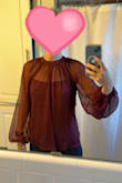 This is a beautiful top! It's made well and looks really elegant. It's pretty true to size but if anything it runs a little big. - Kathleen O.
