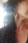 I was invited to a wedding and needed new bling - these earrings are beautiful! I have to note, my earring holes are gauged to a size 8 so I wasn't sure if 'normal' earrings would work, but the piece that holds this in place was tight enough that it was NOT a problem. I wore my thick, curly hair down and to the side; they only got 'lightly' tangled in my messy locks (which was expected for any dangle earrings) but it was totally manageable.These are simply beautiful! At the wedding I had several compliments about the earrings and one of the ladies' husbands had asked me to help him place an order for their anniversary, I thought that was very sweet. I simply LOVE these. - Kt R.
