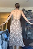 This dress is perfect! High quality and so flattering. It's nice and thick so you don't have to worry about anything showing through. Since it is a little heavy, I would recommend tying a knot on the first loop once you adjust the chest to a level you are comfortable with. - Kasie G.