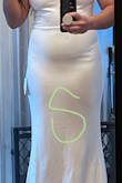 Fabric is of good quality. I originally ordered a small, but the fabric pulled unflatteringly across my stomach and butt. The medium is a better fit for my midsection. I will have to get the top altered, along with a hem, but that's okay. - Rachel T.