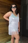 Great dress for NYE! Seemed loose in the waist but tight in the hips. The dress definitely rode up and I kept having to pull it down. Ideally it would have a panty in it to keep it in place somehow. But overall it was an awesome dress - Isabella K.