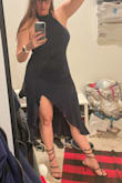 Got this as a potential New Years' dress and I'm very happy! It has a sexy cut in the front leg and a deep back! ETA - Unfortunately after wearing it for more than a minute it was clear that the material was itchy and likely to bother me the whole night - so I decided to return. The zipper also goes up the side of the dress and fell on my bust and underarm in a way that would likely have led to irritation since I was going out dancing for NYE. If you don't mind an itchy material occasionally brushing on your arms and around your neck - this dress is very sexy, and worth consideration (as the liner on the inside of the dress works to keep the itch off). - Sarah W.