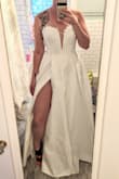 I needed a wedding dress last minute and ordered this dress in a size 10. My boobs aren't that big compared to my chest and waist size, so I thought the small sizing in the bodice that others have noted would be ok. I got into the dress but the bra area was hard to zip up. I ultimately decided to go with something else and returned this dress, but would recommend it for anyone else wanting a ball gown on a budget. Note, I edited my photos to show more of the detailing in the bodice. It's very subtle irl. - Brittany D.