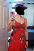 Wow, I'm speechless. This dress is just beautiful. I bought it to wear to a summer wedding. I don't particularly like the peep-show aspect, and it's a little long for me, so I pulled the skirt up and tied it under my breast so it looks like a one-piece dress. And man, this dress looks fabulous. I love it. I cannot wait to wear it to our friend's wedding. Can be worn without a bra in my case. - Sarah T.