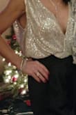 This is a beautiful top however, there is a lot of material. It is very drape-y. Couldn't have worn it without fashion tape to ensure it stayed in place. - Jennifer T.