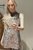 This dress was a showstopper! The sequins were set tight on the fabric and you could easily tighten it with the criss-cross back. I never felt over exposed. The length was great! I purchased to work on NYE and it was amazing! I even paired it with the sheer bodysuit and it made this skater-style dress feel even more like a figure skater dress. Had it dry-cleaned and can't wait for another event to wear! - Alison H.