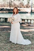 The dress fit everywhere but my shoulders. The dress itself was beautiful and I felt like a princess on my special day. The only thing I didn't like was after walking down the aisle, the train frayed like crazy so it has to be photoshopped out of the pictures and the dress fabric easily snags. - Allyson B.