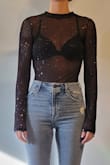 I love this mesh bodysuit. It's very comfortable! The sleeves aren't too tight and you can barely feel the snaps on the bottom. It goes great with almost any bra or undershirt. I like that the sparkles are colorful, it was perfect for a new years outfit. - Jessica A.