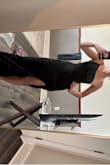 I almost chose to get this tailored to close the slit an inch or two but chose to return instead. It's super comfortable but also would have wanted shapewear since it's pretty skin-tight. - Shelli S.