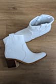 I am in love with these boots! I bought them in hopes to wear them for my wedding and they definitely are better than I hoped! They fit just how they should. I always order boots a half size smaller than my normal shoe size and it fit great. The heel isn't too big and the shaft of the boot is wide enough to have a little room but not too big that it looks weird. I am so glad I bought these!! - Sharon B.