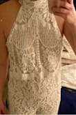 I immediately liked the fit but the pattern on top is the deal breaker for me. The pattern seems inappropriate; it looks like there are breasts designed into the pattern pretty much right above where mine would be (see photo). Once I saw it, I couldn't unsee it. The photos of the model show the same pattern on top a little differently so the issue is likely the way the fabric was cut. There's no way I could wear this for a bridal shower or my reception which is what I was thinking of doing. Disappointing. - Lyndsay G.