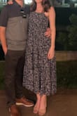 This dress is so gorgeous. I received so many compliments on it. The quality is great and it's so comfortable. The fabric has some metallic threading woven in, so it looks expensive, too. I'm 5'2" so it's a little longer on me than the model. (I only have a dark photo.) - Emily T.