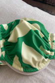 I was super excited about the pattern and fit of this top, and ordered it pretty much as soon as it arrived online. Unfortunately, the color and fit are a bit strange. The top (pictured) and matching bottom are not the white / cream and green that it looks like in the photo, but a light green / yellow and green, so I wasn't a fan of that. However, the biggest disappointment was the fit. The cup sizes are super small and oddly close together. I'm only a 32B and it really looked odd on me, so I can't imagine anyone with a larger chest fitting into this. Sadly, I'm returning both the top and bottom. 

However, I will shout out LuLu's customer service! USPS delivered this to the wrong address, and LuLu's had just offered me a refund or to ship a new version at the exact same time that my neighbor came and delivered this to me. I appreciated their help! - Abby M.