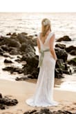 This was the dress I decided to keep for my wedding. It fit like a glove, no alternations needed. I added a green silk sash to the waist to break up the white a little. It was comfortable and not too hot even for my Hawaii wedding. I was a little undecided about the train (especially on the sand!) but it added a lot to the pictures. - Molly L.