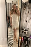 Wore this for NYE and got so many compliments. True to size, fits perfectly, and is very flattering. I didn't need to wear a bra under this.
Like the other reviews noted; strings do fall off this dress (not enough to be noticeable, I just found some on the floor.) There are spare strings that come with the dress. Love how fun this is while still being dressy. - Lindsay C.