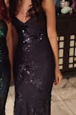 This dress for great and has a nice material. It was very comfortable and had a thicker feel to it than I expected. The back was stunning, but the straps would rest quite far apart no matter how tight I laced it. I had to hold the top up to not flash everyone. I ended up unlacing the back and tying a knot at the back of my neck to get the straps to stay higher and then relaxing the dress. Be careful with that! - Michelle R.