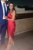 I ordered this dress for an early fall wedding and it was perfect! I wanted something a little bold but that was also classy and appropriate. The one-shoulder sleeve is very pretty and I could wear a strapless bra with it! The goddess-like draping of the skirt is flattering as is the cinching under the bust. The silky fabric and slit in the skirt offer a little subtle sexiness too. I paired this dress with nude heels and just a little simple jewelry. The red color popped in every picture and can work for many times of the year. The wedding was months ago and I still love this look! - Amy G.