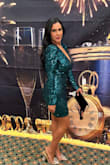 I bought this to wear on New Year's Eve and received so many compliments about the color and fit! Very flattering and classy. I ordered a large because I'm a bit tall and I didn't want it to be so short but I could have gotten away with ordering a medium. Either way it looked great! Loved it! - Sabrina E.