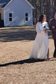 After reading some other reviews I sized up to an XL, I couldve done a L but for comfort I stuck with the XL (Ive had 3 kids so my body is not what it used to be). We had a last minute wedding for our 15 year dating anniversary and aside from the perfect lace accents and the backless detail I couldnt have asked for a better dress. Highly recommend! - Lauren Z.