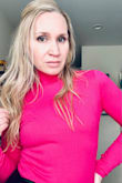 This is definitely fitted. I ordered the Small and I wouldn't describe it as super tight but it's a fitted bodysuit for sure. The color is very vibrant. It's really cute! - Erin A.