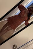 This is fitted at the waist. If your waist is bigger than 31 inches get an xl! It's so flattering. Perfect length and cleavage without being too revealing. Going wine tasting in it :) - Joley H.