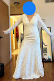 I loved everything about this dress - it is simple, elegant, has just enough train. I was worried the material would be itchy - definitely not the case. The only thing "wrong" was I felt the shoulders were a little loose and could easily slip off - nothing a little tailoring couldn't fix! The shoulders do have a bit of non-slip material to make sure they do stay in place once fitted right. The picture looks a little long, but once I put shoes on, it was just the right length. This would have been my wedding dress - but I ended up trying one at a bridal boutique and fell even more in love with it than this one. - Johnna B.