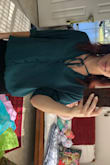 Gorgeous color, good material, shoulders, chest, and sleeves fit great (I ordered an XS), but it is very long. I just tuck it into my jeans and it looks great! - Kira H.