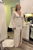 This is the perfect dress for a boho bride on a budget! I can't believe women spend 2000 on a dress and I found this steal. The sleeves are so fun for dancing at the reception. The top has the perfect amount of cleavage. - Erin G.