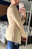 The style is cute which is why I didn't give it a 1 star. The material is super thin and cheap. I won't be able to wear anything other than white underneath it. You can see in the picture that the stripes are clearly seen through the material. - Kerry C.