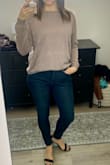 Nice lightweight sweater, I love the details on it. Ive been wearing it with a nude colored bra underneath. Super cute as is or I tuck the front in a tiny bit. - Darcey B.