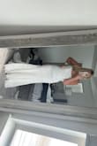 I tried on about 10 dresses. Some over $2000 and some around $500. None compared to the quality and fit of this. Fit me perfectly out of the bag and I am so so impressed. I ordered based on their fit tool and got a 10 and it fit perfectly. Just order!!!! - Caitlin N.