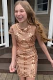 I purchased this dress for my 12 year old daughter. She wore it to a Bat Mitzvah and received tons of compliments. I ordered her an XS and it fit her perfectly. - Maria L.