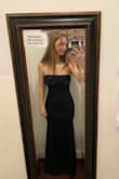 Got this to wear to a military ball and my boyfriend and friends loved it (and so did I!!) The hourglass shape of this dress is unmatched. My hips are a lot larger in proportion to my waist so the Medium hugged my hips perfectly and I LOVED the shape the dress gives. The only problem I had was a little extra loose fabric around the waist/tummy. I went back and forth on whether I should exchange it for a Small but ultimately decided it would be too small in the hips if I did. I got it tailored to take in the waist but probably could have gotten away with a little extra fabric around the tummy. I normally never buy strapless but this sits really well, especially if you wear a thicker bra. The length was perfect for me wearing about 4-inch heels. This dress is classy, understated, and I can't wait to wear it again! - Abigail L.