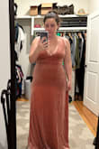 This dress is soft to the touch but has a nice weight to it (but not too much).  The color was a bit deeper hue of blush rose pink in person but I still love it!  Ill need to have the length hemmed but I expect that with any long dresses because Im not tall.  I honestly cant believe how good the quality is for the affordable price. - Leslie O.