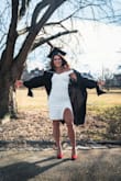 I wore this for my graduation photos and I absolutely love it. It's stylish and sleek, not too short length-wise. I love the fabric, it's thicker so you won't see any lines (or need shape wear). Highly recommend. - Morgan J.