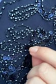This dress is beautiful and generally well made. I am returning it because some of the beading detail is broken, looks like some of the threading has come loose. - Gillian H.