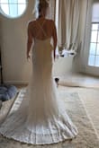 I ordered the dress for my wedding, and I was kinda nervous about ordering it because of the price but it was so worth it. This dress is amazing and the pic on the website don't do it Justice to the detail in the lace and the back of the dress drags the floor so beautifully. - Angela W.