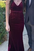 I ordered this dress for a wedding. I was nervous about buying it without trying it on, but I wasn't having any luck finding anything in stores. It ended up being perfect for my occasion. It was a bit stretchy, which was great. I honestly could have gotten away with an extra small and it may have been more fitted around my boobs but still stretchy enough for my hips. But the small was flattering as well. I just wore a bra that had a little bit of padding and the top fit just fine! Also loved that I could wear a bra with it. Although part of the straps are somewhat thin, they were still thick enough to completely hide the straps on a regular bra. I'm somewhat tall and the dress was long enough for me to wear low heels. The color definitely leans more of a deep red than purple, but still very pretty. Super comfortable too! I was happy with my purchase! - Kate R.