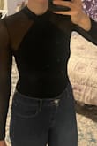 I love this body suit so much. I bought a second one because I want to keep wearing it for a long time and have back-up. You can dress it up or down. It's so versatile. I've worn it 4 times and after the last wear it started fraying a bit at the seams between the sheer and non-sheer part. I think the material is a bit delicate and maybe I shouldn't have danced in it where I was moving my arms a lot. I wear it with a backless, adhesive bra, which surprisingly stayed in place- usually if I am dancing/sweating at all, the sweat causes the bra to slip down a bit with other tops, but since the bodysuit is fitted, it holds the bra in place so perfectly, and I don't think it makes my boobs look weird. I get so many compliments every time I wear it. It's sexy but classy. I think it looks nice with high-waisted jeans or skirt. - Nathalie E.