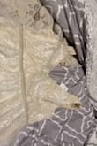 The material was to be expected for the price. Low quality, do not recommend the ivory. It got super snug up top, definitely size up. I found the beaded waistband to be super tight and made it hard to pull the zipper past that point. Will be returning as it didn't fit and was lower quality than expected based on the photo. - Courtney L.