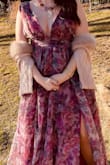 I absolutely loved this dress! This was the dress of my childhood dreams. Flowy, flowery, and colorful. I attended an inaugral ball, and received so many compliments all night. Plus I felt this dress was so unique. I didnt see another dress like it.  I made it more acceptable for the winter season with burgundy closed toe shoes and a pink fur shrug. The only problem was it was loose on top. This was because I am 10 inches smaller in the chest than my hips, so I would have needed to get it altered. I used a plunging bra and double sided tape. - Kaitlyn H.