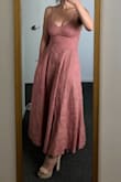 I bought this dress for a work event. I think it's really cute. It's not stretchy though. I'm in between sizes, typically a small on top (more of my weight is on my thick thighs) I'm sometimes a medium. The one I got is a small and REALLY tight around my chest and zipper area...my event is this weekend and I've trying to eat healthy so I'm not bloated the day of the event and have the dress rip on me. BUT I think if I would've gotten a medium, it would've been too loose. (Plus I love how my boobs look ha!) The fabric is a little cheaper than how it looks in the pic, but even in person it looks nice, it just feels cheap. I would recommend sizing up if you're in between sizes, for sure! If it's a little loose maybe just tailoring it to fit right. - Berenice C.