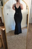 I was shook. I didn't need a bra or spanx. It sucked me in but was super comfy. The waist was a little big but I'm used to that and can take it in. It wasn't super long perfect with heels. Wearing as a bridesmaid dress. - Karissa E.