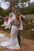 If you are thinking about getting this dress- this is your sign to get it. I searched high and low for a bell sleeve wedding dress. The only other style I found that I liked was a $4,500 dress. This has the quality of a designer dress. I ordered a size medium, and it fit me like a GLOVE. I did get the waist taken in about 0.5" on each side, and tacked the lining to the lace. I didn't wear a bra or shapewear whatsoever. When I told the girls where I got my dress and how much I paid for it, their jaws DROPPED. I got so many compliments! Side note: you can also wash this dress. I had gotten red mud on it during the reception. Took a risk the day after the wedding and washed it on the "hand wash" setting in my washing machine and hung it to dry- held up great! - LEIGH A.