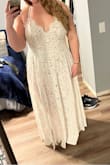 I bought an XL and a 1X since a lot of people said to size down. Based on their size chart I'm a 1X, which is the size that fit best. I had to have the straps altered to hold my boobs up and had some of the dress sewn shut to help with coverage- I'm a 40D so it was too much cleavage for me. I'm also probably going to have a nude skirt sewn in. The dress is stunning though! I can't wait to wear it to my wedding shower and on our honeymoon! - Stacy S.